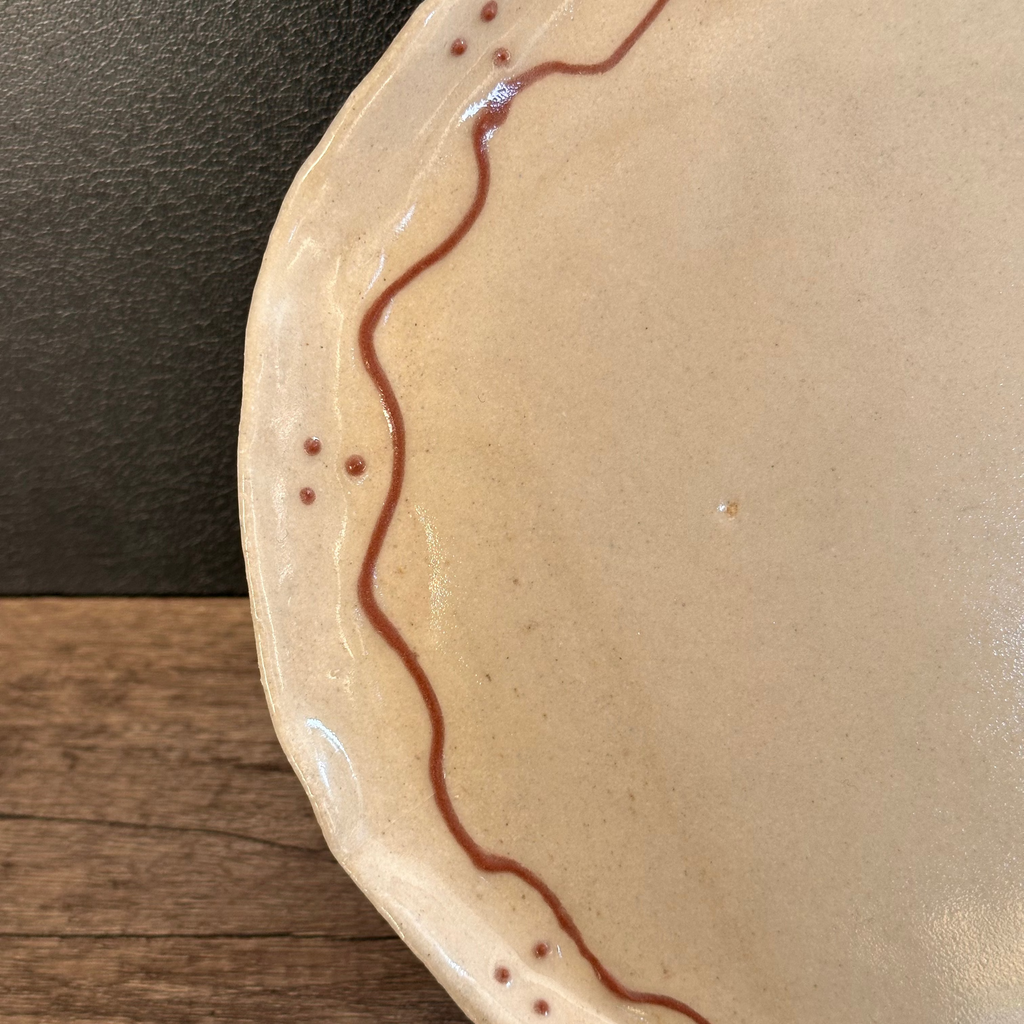 Lightly speckled handmade ceramic plate with terracotta slip decoration