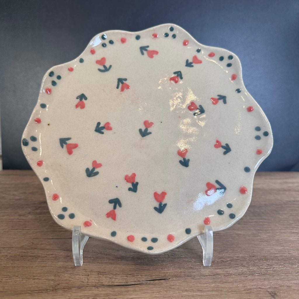 Handmade ceramic plate with decorative floral hearts pattern dark pink and green